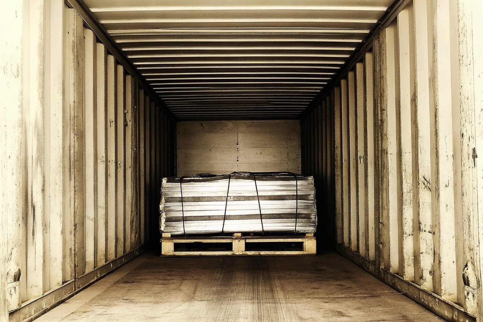 Inspector checking humidity damage in a container