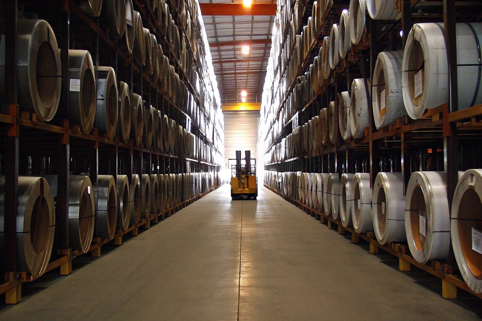 Warehouse racking with labeled steel coils