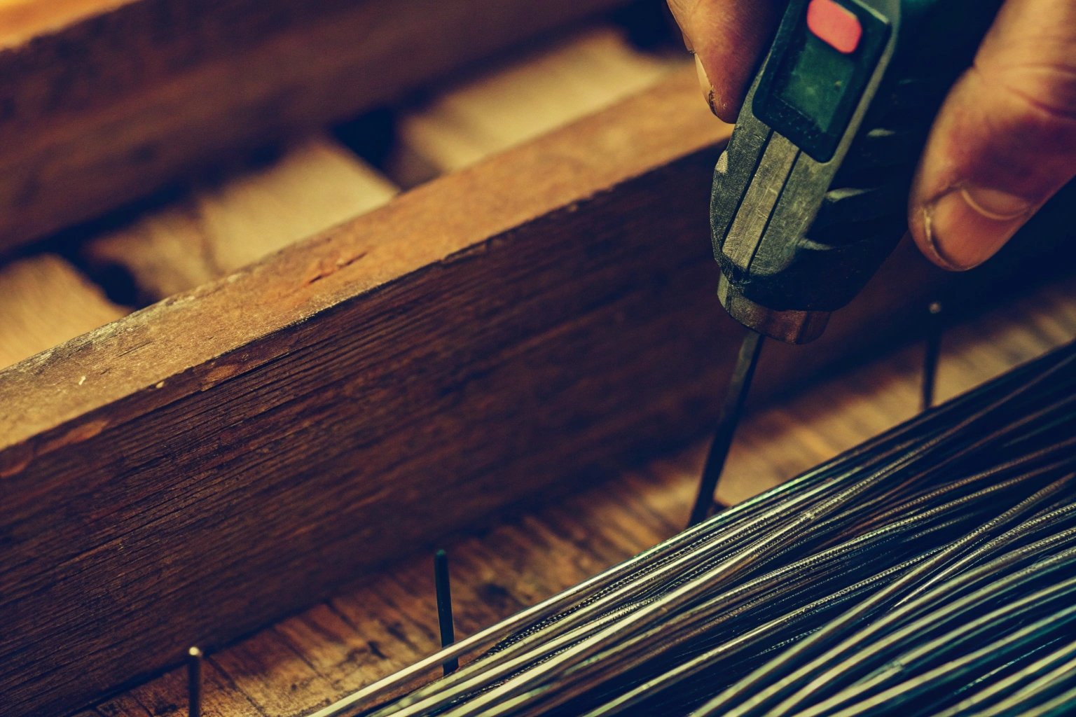 Inspector using a digital moisture meter on a container floor